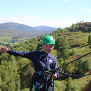 Happy abseiling kid